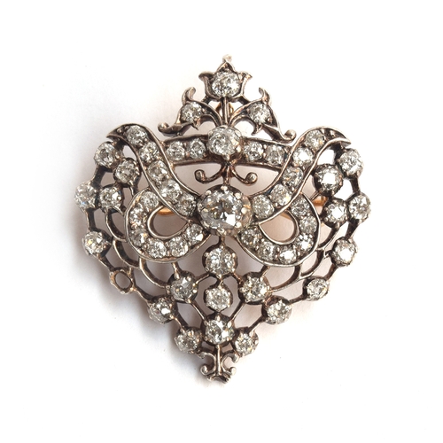 19 - A Belle Epoque gold, silver and diamond set openwork pendant brooch, set with 51 old cut diamonds (o... 