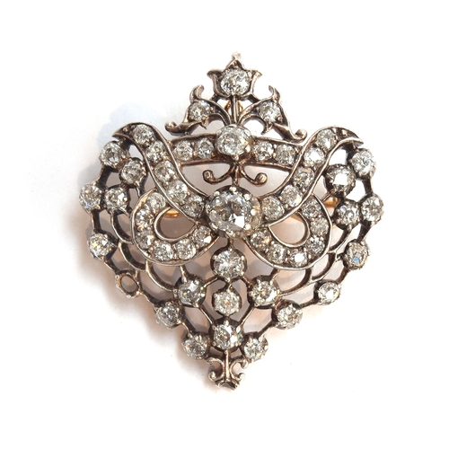 19 - A Belle Epoque gold, silver and diamond set openwork pendant brooch, set with 51 old cut diamonds (o... 