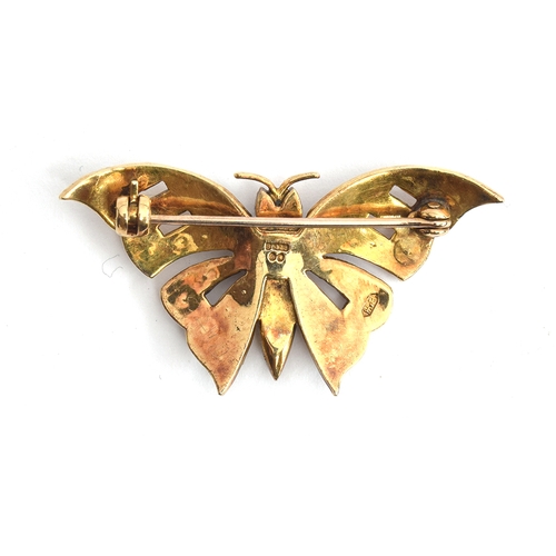 25 - A 9ct gold brooch in the form of a butterfly set with opals and ruby eyes, approx. 5.4g