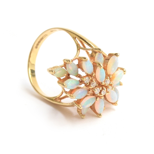 10 - A 14ct gold modernist dress ring set with 18 marquise cut opals surrounding diamonds, size M 1/2, ap... 