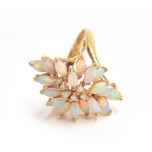 10 - A 14ct gold modernist dress ring set with 18 marquise cut opals surrounding diamonds, size M 1/2, ap... 