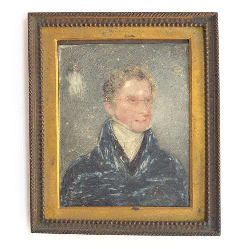 101 - A 19th century portrait miniature on ivory of a gentleman in Regency dress, in a brass frame, 8.5x7c... 