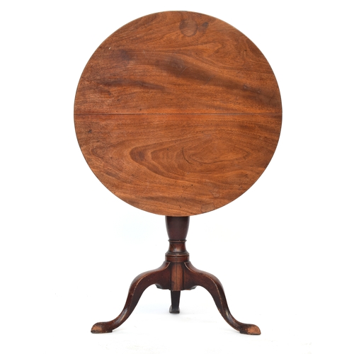 520 - A George III mahogany tripod table, the tip-top on a vase turned column and cabriole legs with point... 