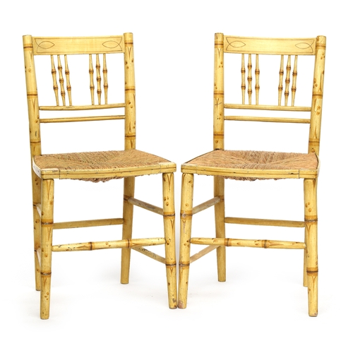 615 - A pair of 19th century faux bamboo painted side chairs, with rush seats

Provenance: from the estate... 