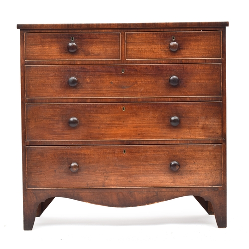 486 - An early 19th century mahogany chest of two short over three graduating drawers, on bracket feet, 10... 