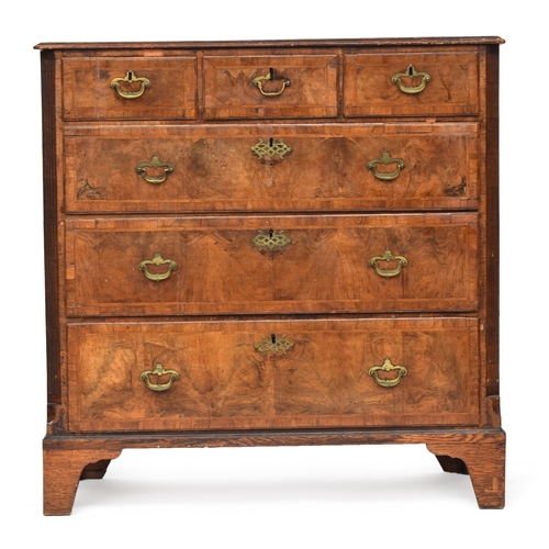 476 - A largely 18th century walnut chest of drawers, the later pine top over three short and three gradua... 