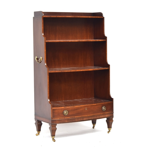 514 - A Regency style mahogany and line inlaid waterfall bookcase, four shelves with drawer below, (one br... 