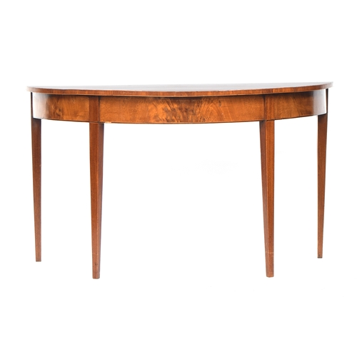 585 - A pair of George III mahogany demilune tables, the tops with radiating veneers, on plain square tape... 