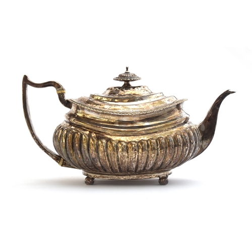 68 - A George III silver teapot by Solomon Hougham, London 1815, with part fluted body, the scroll handle... 