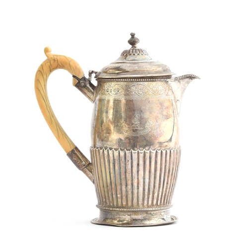 73 - A Victorian silver coffee pot, London 1875, with bright cut vine leaf border, over an armorial crest... 