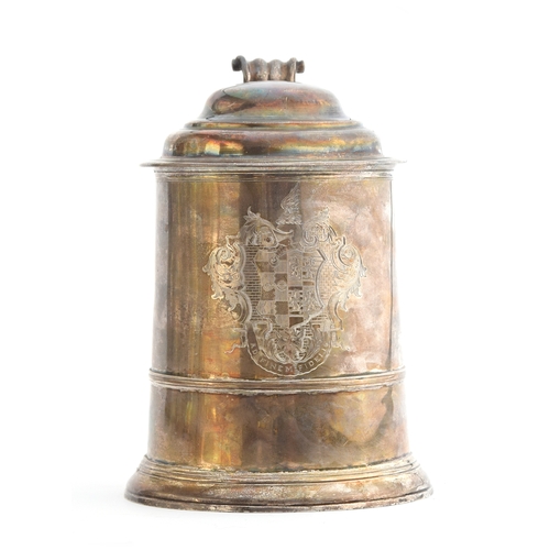 76 - A substantial George II lidded tankard, by Edward Pocock, London 1734, the hinged dome cover with th... 