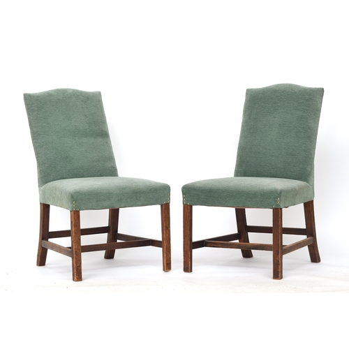 610 - A pair of George III side chairs, the handsomely raked upholstered backs with serpentine top, stuffo... 