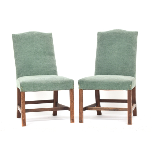 610 - A pair of George III side chairs, the handsomely raked upholstered backs with serpentine top, stuffo... 