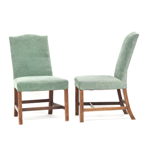 610 - A pair of George III side chairs, the handsomely raked upholstered backs with serpentine top, stuffo... 