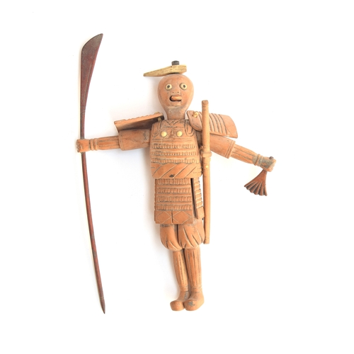 172 - A Japanese Kobi carved wood samurai holding a naginata, with articulated limbs, 13cm high

Provenanc... 