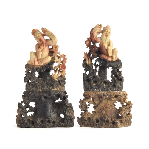 167 - A pair of Chinese carved soapstone figures of immortals, each 17cm high

Provenance: the Peto Family... 