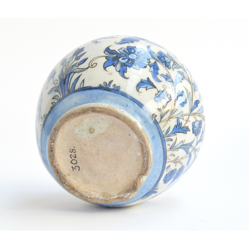 154 - An Iznik style ovoid vase, blue floral decoration, marked to base '3028', 18cm high

Provenance: the... 