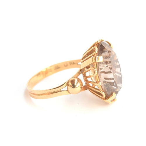 5 - An 18ct gold dress ring set with a large smoky quartz, size S 1/2, 6.7g