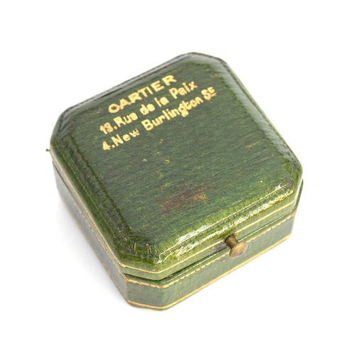 38 - An early 20th century Cartier presentation box, green morocco leather with gilt embossed design, the... 