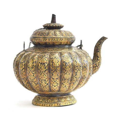 152 - A 19th century Thai niello gilded silver kar-nam-tom teapot, of lobed form on a spreading base, prof... 