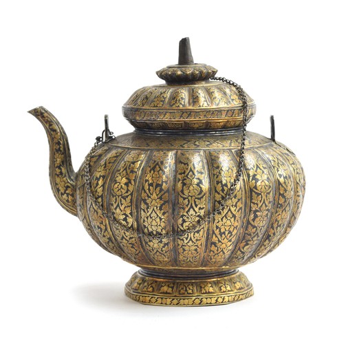 152 - A 19th century Thai niello gilded silver kar-nam-tom teapot, of lobed form on a spreading base, prof... 