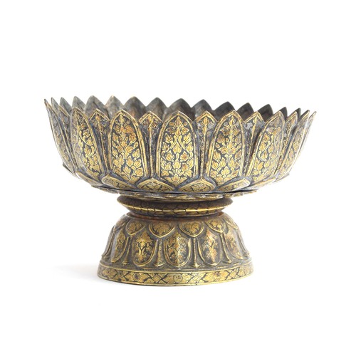 153 - Two 19th century Thai niello gilded silver footed bowls of lotus form, each with petal shaped rims o... 