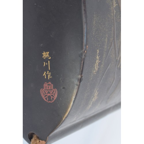 116 - A 19th century Japanese three case black lacquer inro, with gilt hiramakie decoration, one side depi... 