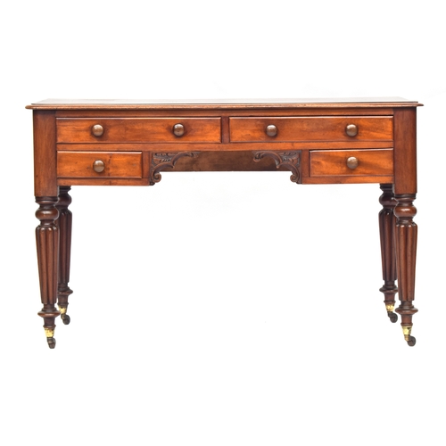 580 - A Victorian mahogany side table, in the manner of Gillows, four drawers around a kneehole, on fluted... 