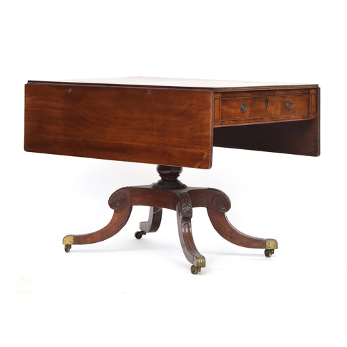 565 - A Regency mahogany Pembroke table, with single frieze drawer and opposing blind drawer, raised on a ... 