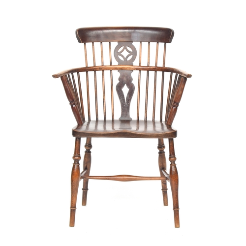 627 - A 19th century ash and elm comb back Windsor armchair, the curved top rail over a pierced splat, the... 