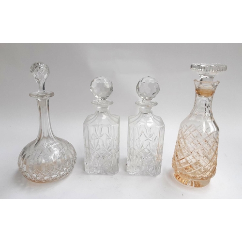 125 - Four cut glass decanters to include a pair, the tallest 29.5cmH