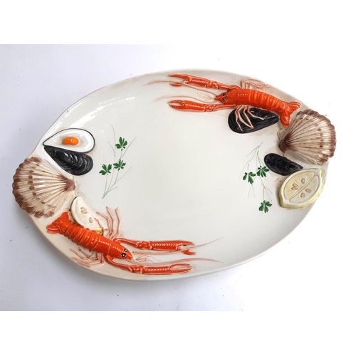 127 - A Cre Art, Italy, serving platter decorated with crayfish and other seafood 51cmL