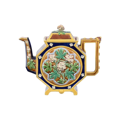 197 - A Minton majolica teapot and cover modelled as a Chinese figure, date code for 1874, faintly impress... 