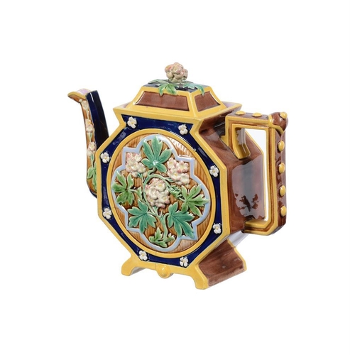 197 - A Minton majolica teapot and cover modelled as a Chinese figure, date code for 1874, faintly impress... 