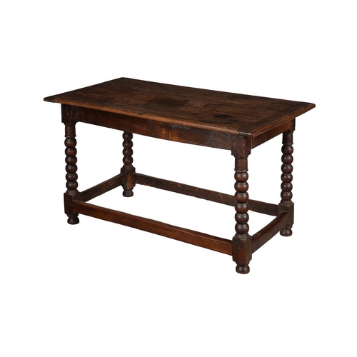 464 - An early 18th century oak side table, the rectangular top above bobbin-turned legs, 131cm wide, 71cm... 