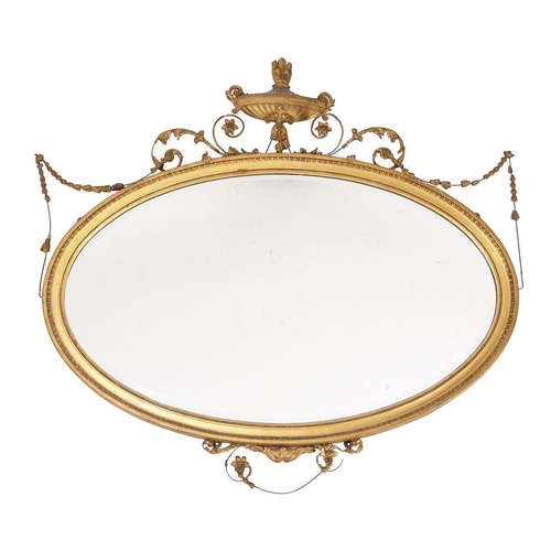 392 - A late 19th/early 20th century giltwood oval wall mirror in Adam style, 125cm wide, 123cm high