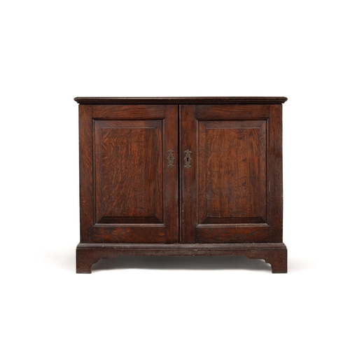 462 - A George III oak dwarf press cupboard, c.1780, the rectangular top with moulded edge above a pair of... 