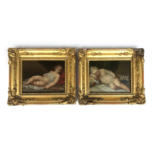 301 - A pair of 19th century oil on boards depicting sleeping putti, each bearing red wax seal to verso, i... 