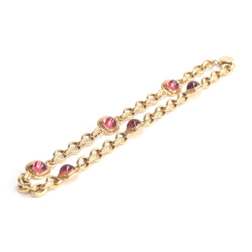 37 - A Cassandra Goad 9ct gold necklace, the chain interspersed with six gold mounted pink tourmaline sug... 