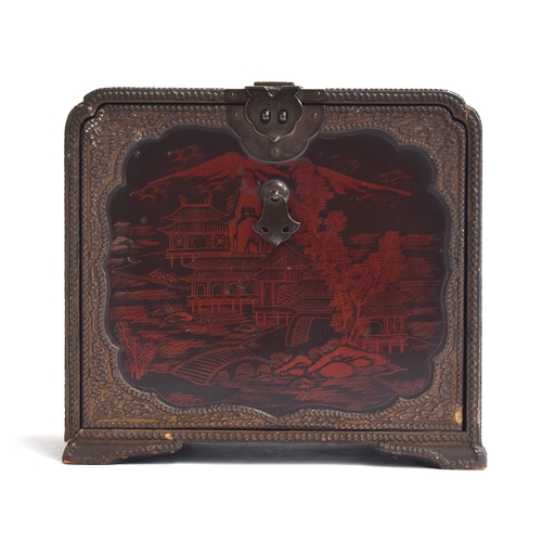 117 - A Chinese red lacquer and gilt metal table cabinet, the front decorated with a mountainous landscape... 