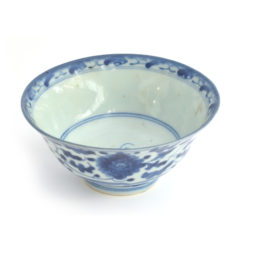 149 - A Chinese 19th century blue and white 'Kitchen Qing' porcelain bowl, floral design, marked to base, ... 