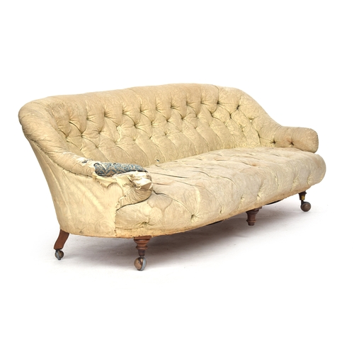 601 - A Victorian button back sofa, probably Howard & Sons, on turned legs and Cope & Collinson brass caps... 