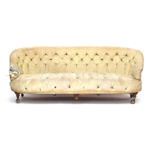 601 - A Victorian button back sofa, probably Howard & Sons, on turned legs and Cope & Collinson brass caps... 