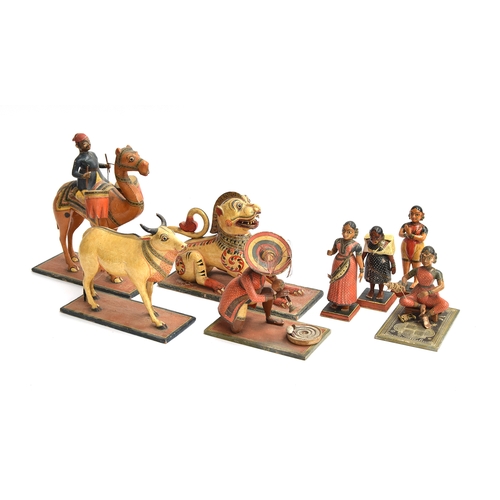 174 - A collection of eight late 19th/early 20th century Indian painted papier mache folk art toys in the ... 