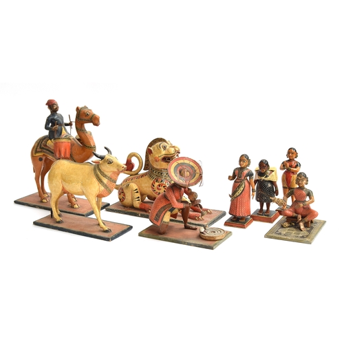 174 - A collection of eight late 19th/early 20th century Indian painted papier mache folk art toys in the ... 