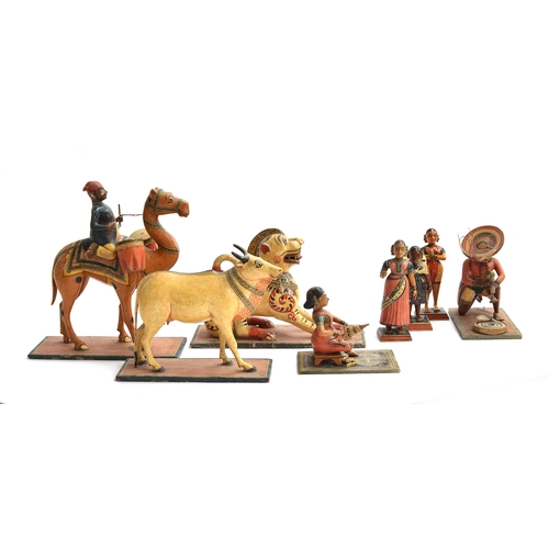 174 - A collection of eight late 19th/early 20th century Indian painted papier mache folk art toys in the ... 