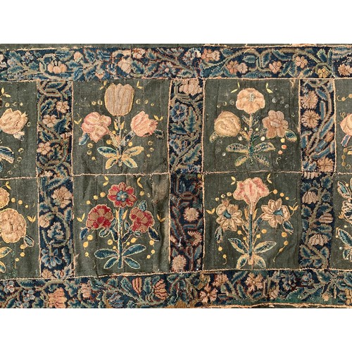 652 - A 17th century needlework tapestry table carpet, ten floral needlework slips depicting tulips, daffo... 