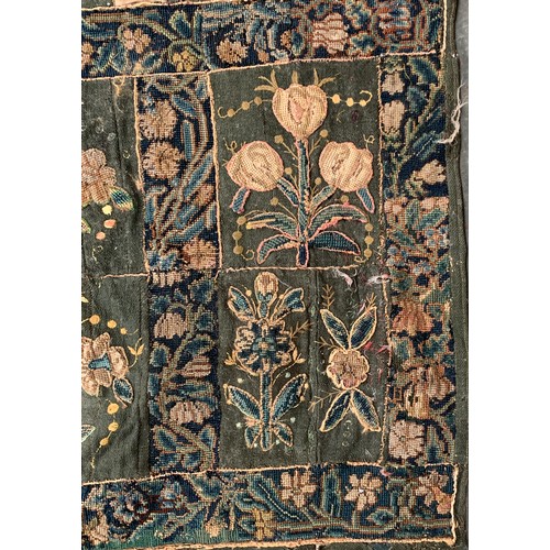 652 - A 17th century needlework tapestry table carpet, ten floral needlework slips depicting tulips, daffo... 