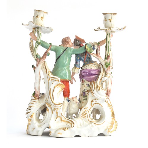 188 - A 19th century Meissen style porcelain figure group candle holder in the form of a continental coupl... 