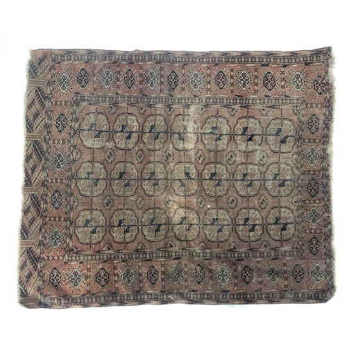 670 - A small rather faded tekke rug, 117x139cm